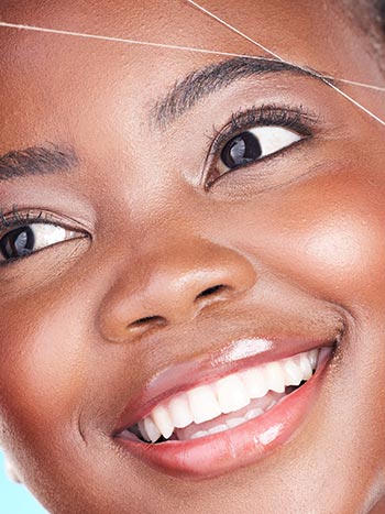 Brow Threading on a woman