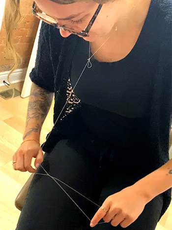 Brow Threading Course with a piece of thread