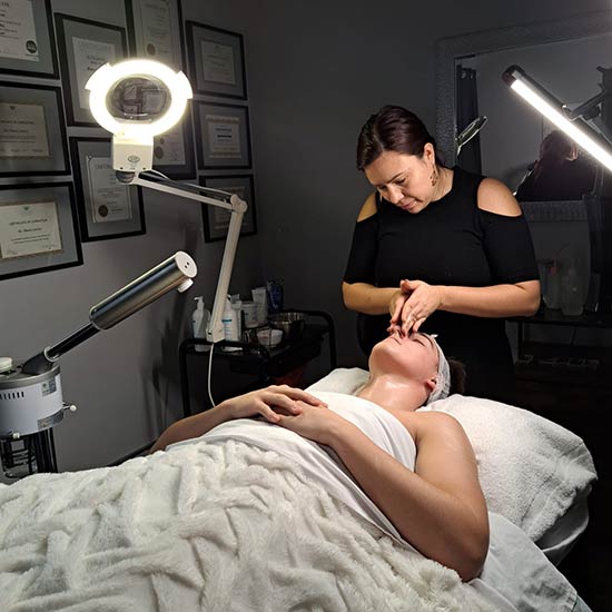 Blanca giving a dermaplaning facial